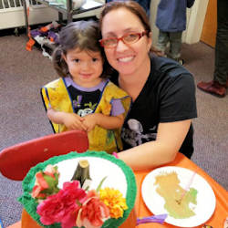 Parkside preschool student gets some help from mom in completing a special project