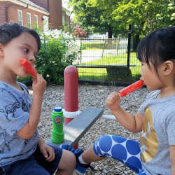 Parkside preschoolers enjoying a special treat in the playground